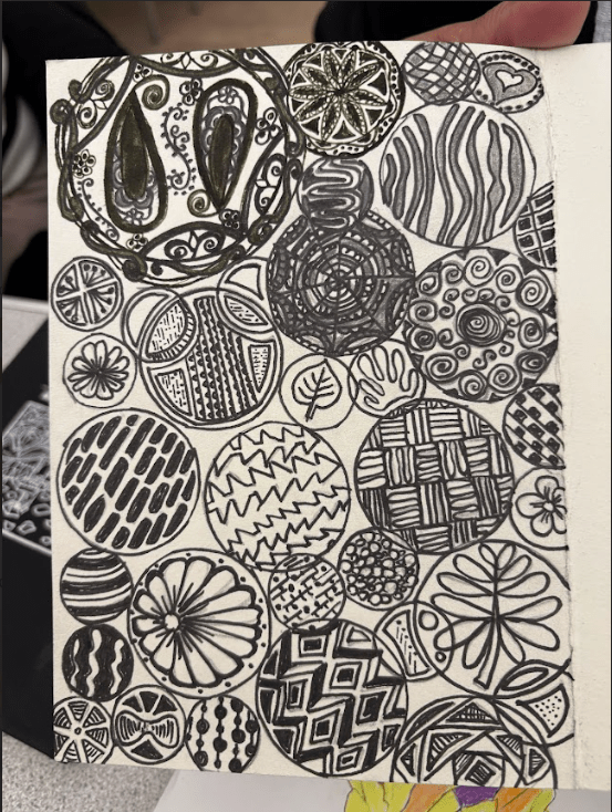 Commonplace book design. Various circles with various patterns inside i.e. flowers or lines. Done in black marker.