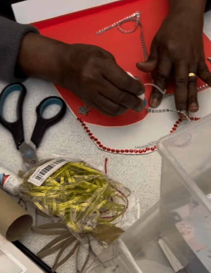 Participant measuring red gems to go on their red base