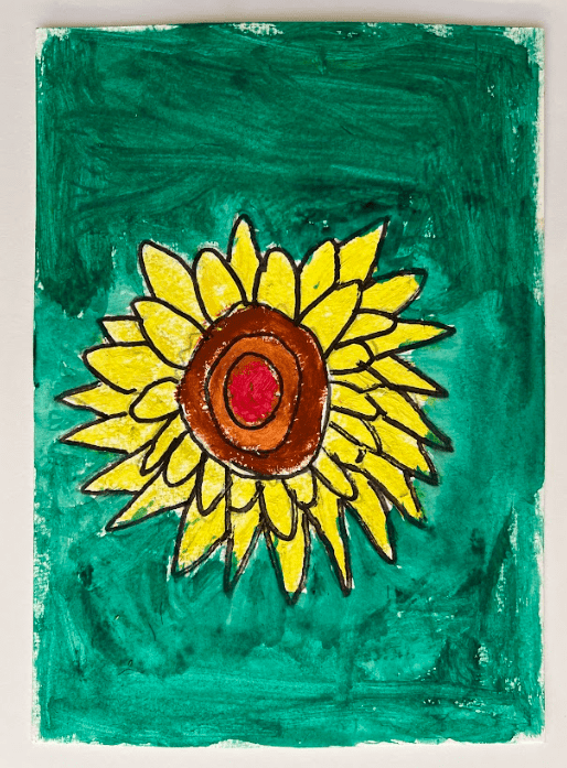 Yellow Sunflower with brown and orange middle, on a green background.